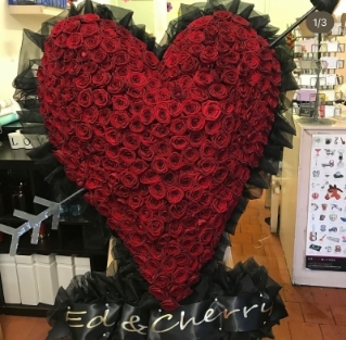Red rose heart on a stand